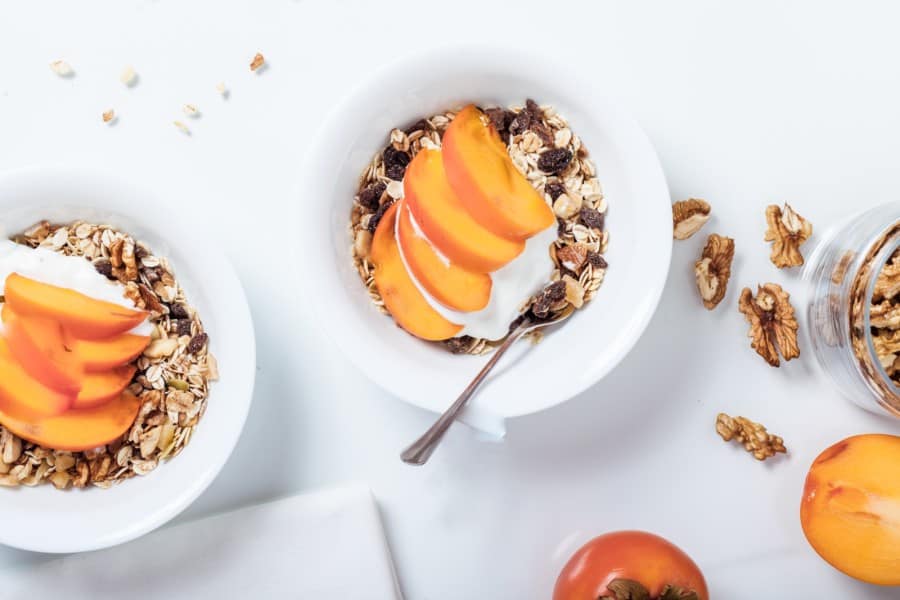 Breakfast bowls with peach and granola