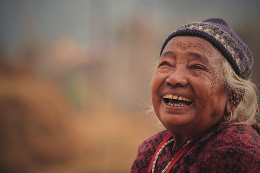 Close-Up Photo Of an old Woman laughing